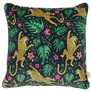 ethically produced velvet cushion with leopard print and monstera leaves