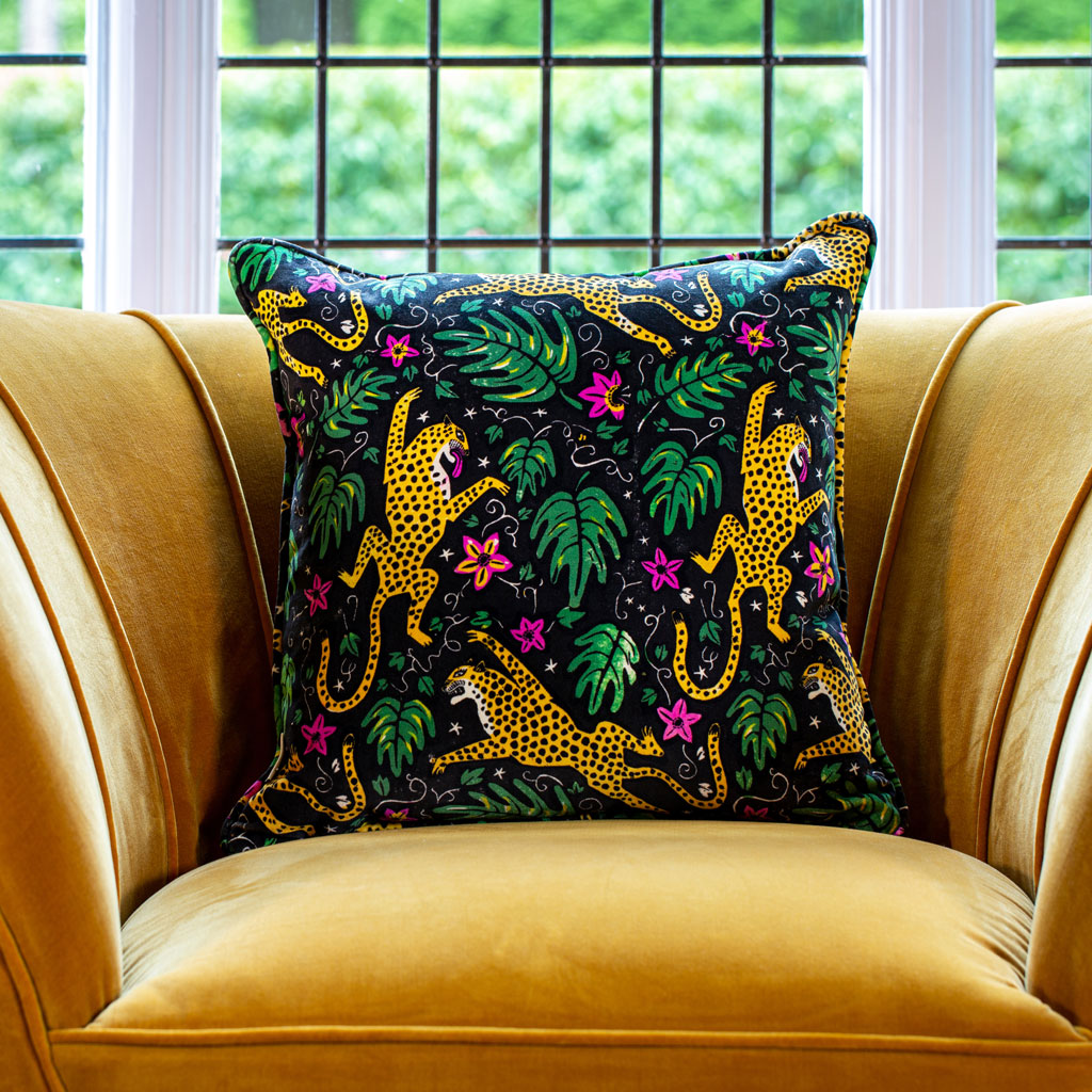 Luxurious animal print cotton velvet cushion featuring leopards and monstera leaves The Monkey Puzzle Tree