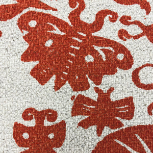 Close up of orange screen printed linen cotton upholstery fabric woven in England