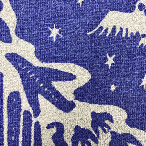 Close up of blue screen printed linen cotton upholstery fabric woven in England