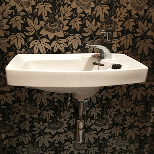 black wallpaper in downstairs loo
